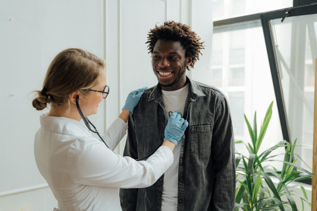 Doctor checking a patients heartbeat